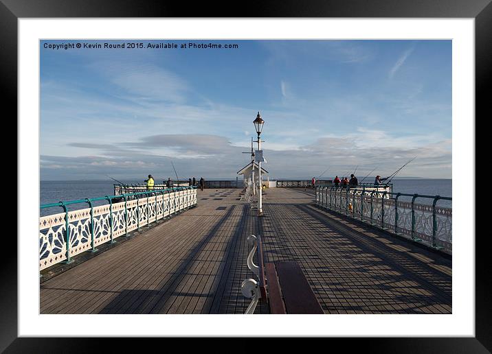 People fishing on Penarth Pier, Wales, UK Framed Mounted Print by Kevin Round
