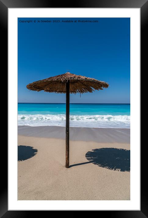 A straw topped Beach Umbrella on Lefkada Framed Mounted Print by Jo Sowden