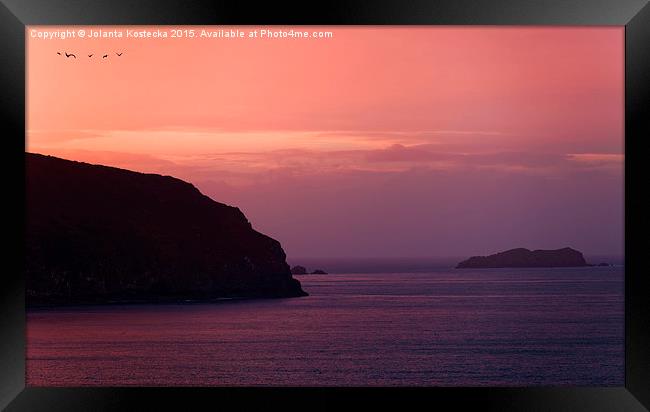 Sunset over the coast  Framed Print by Jolanta Kostecka