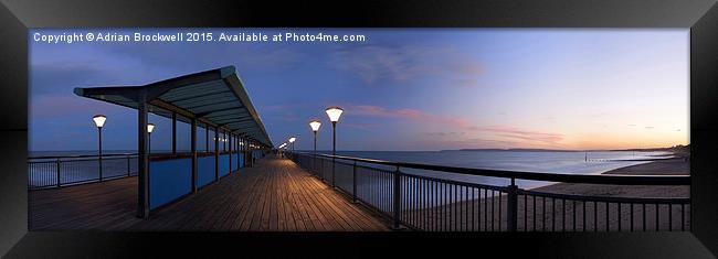 Boscombe Pier at dusk Framed Print by Adrian Brockwell