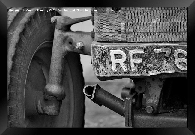  Old Farm tractor slowly falling apart. Framed Print by Angela Starling