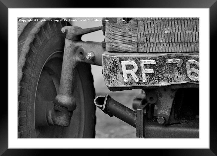 Old Farm tractor slowly falling apart. Framed Mounted Print by Angela Starling