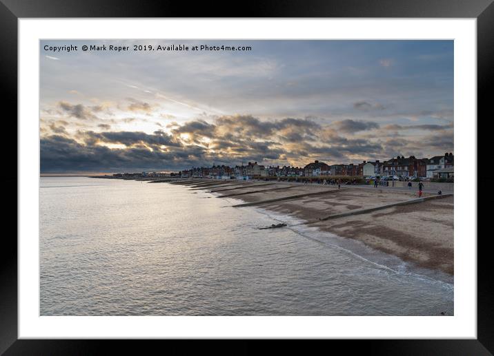 Felixstowe seafront with golden sun behind clouds  Framed Mounted Print by Mark Roper