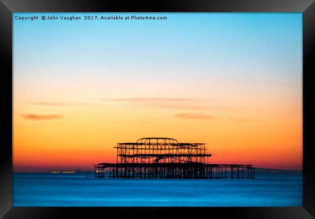 Sunset over West Pier Framed Print by John Vaughan