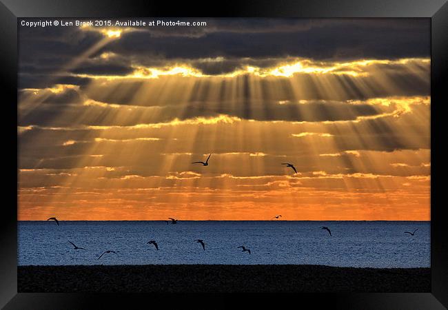 Worthing Beach Sun Rays Framed Print by Len Brook
