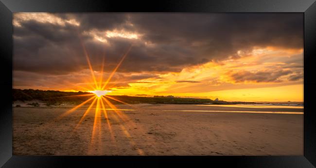 Sunburst and Bamburgh Beach Framed Print by Naylor's Photography