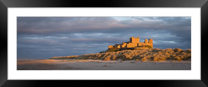 Bamburgh Castle as the Sun goes down Framed Mounted Print by Naylor's Photography