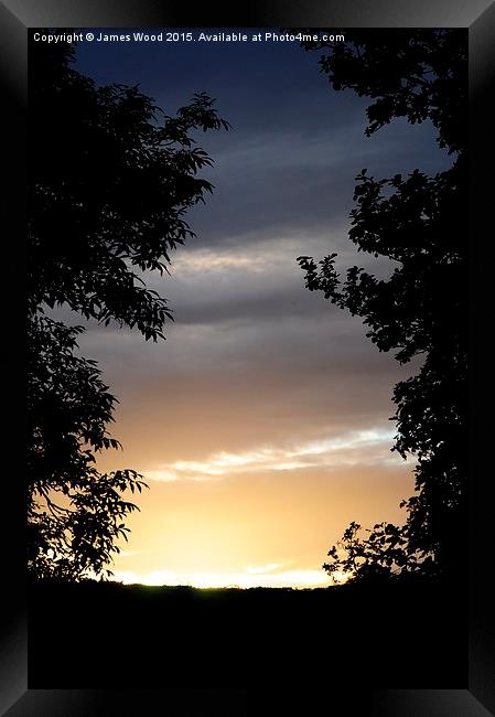 Silhouetted Sunset Framed Print by James Wood