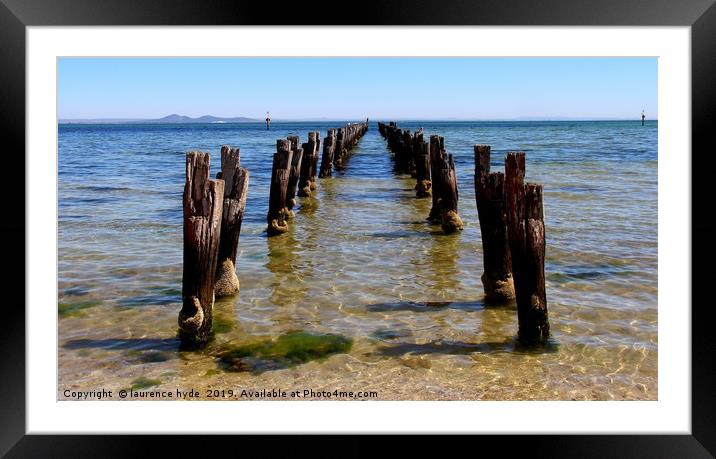Remains of the old wooden landing stage on the bea Framed Mounted Print by laurence hyde
