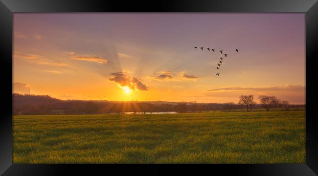 A sunset over fields Framed Print by John Allsop