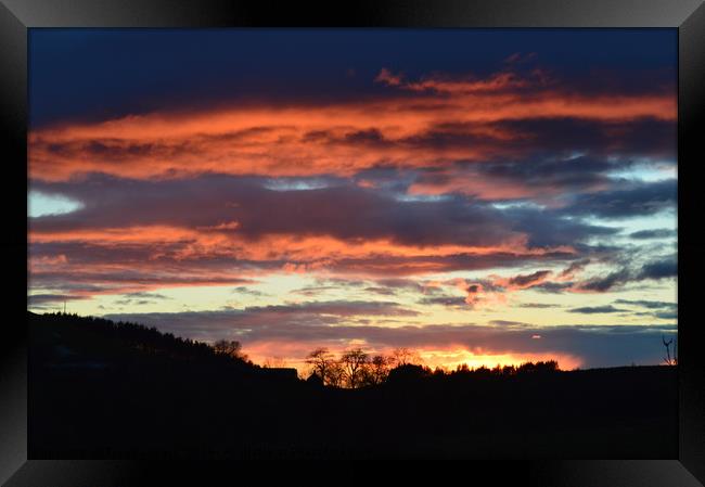 sunset behind wild clouds Framed Print by Tanya Lowery