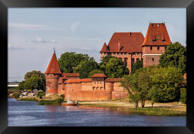 Malbork Castle at Nogat River in Poland Framed Print by Artur Bogacki