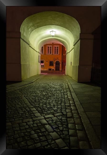 Empty Cobbled Street In City By Night Framed Print by Artur Bogacki