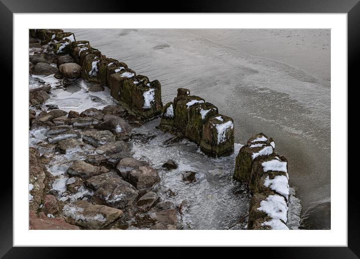Frozen River With Old Wooden Posts Framed Mounted Print by Artur Bogacki