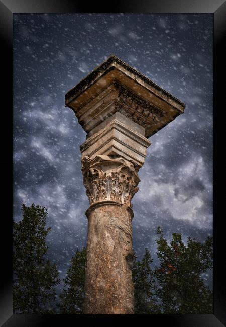 Ancient Corinthian Column Against Stormy Sky Framed Print by Artur Bogacki