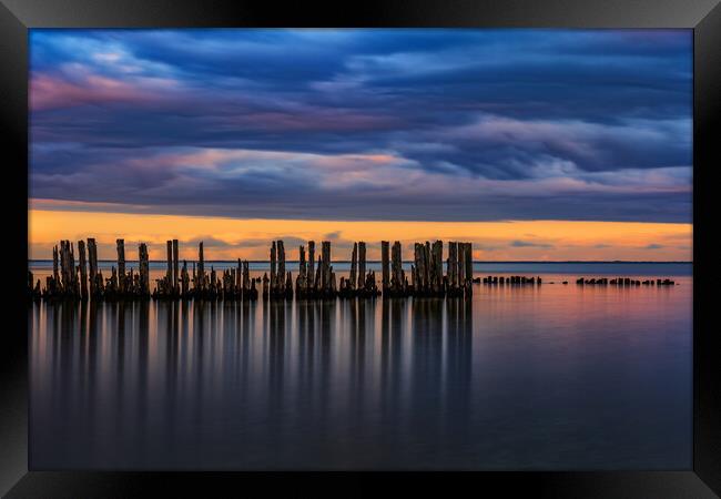 Old Sea Pier Wooden Posts At Twilight Framed Print by Artur Bogacki