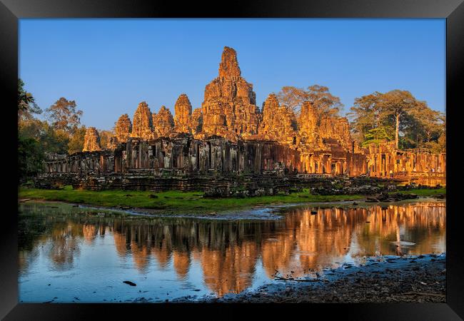 Bayon Temple At Sunset In Cambodia Framed Print by Artur Bogacki