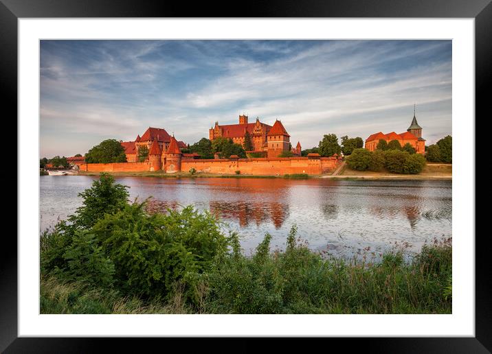 Malbork Castle in Poland at Sunset Framed Mounted Print by Artur Bogacki