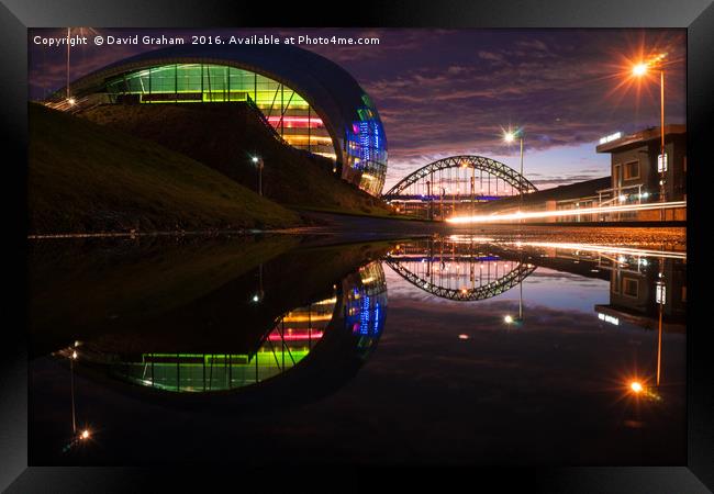 Sage Gateshead & Tyne Bridge reflected in puddle Framed Print by David Graham