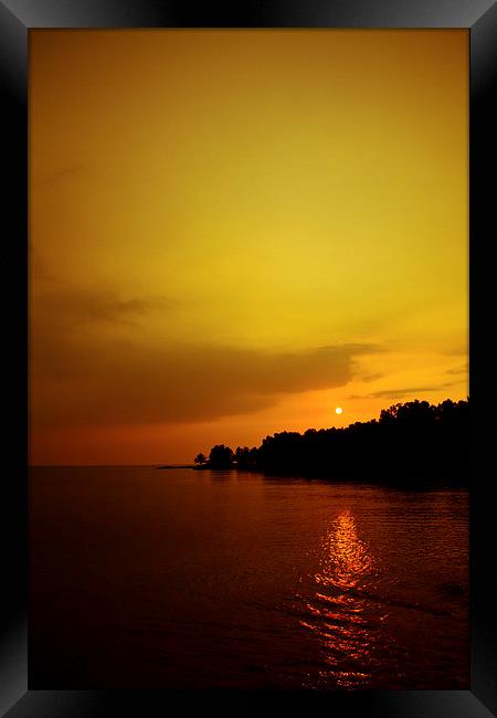 Sunset in Carlita, Indonesia Framed Print by Julian Bound
