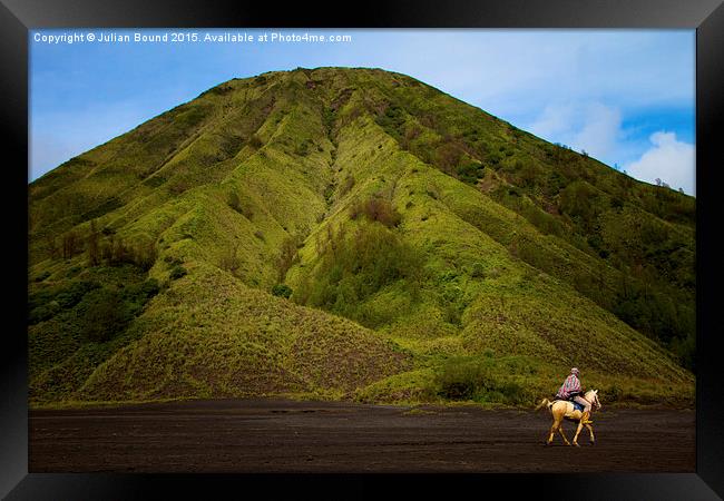 Bromo volcano and a lone horseman, Bromo, Indonesi Framed Print by Julian Bound
