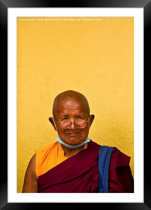 Elderly Tibetan Buddhist monk, Boudhanath, Kathman Framed Mounted Print by Julian Bound