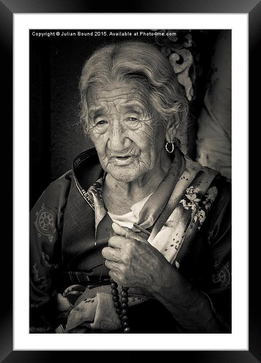 Elderly Tibetan lady, Boudhanath Temple, Kathmandu Framed Mounted Print by Julian Bound