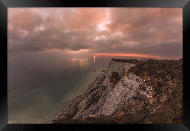 Beachy Head Sunsetting Directly behind the lightho Framed Print by Daniel Frederick