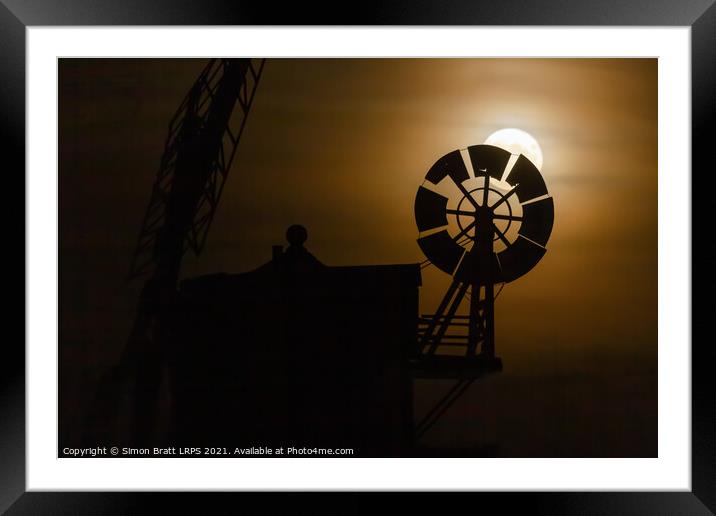 Cley windmill silhouette with full moon fantail Framed Mounted Print by Simon Bratt LRPS