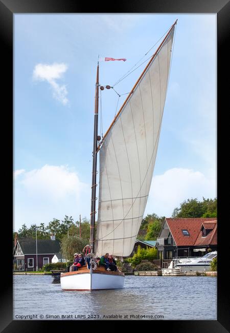 One Wherry sail boat on the Norfolk Broads UK Framed Print by Simon Bratt LRPS