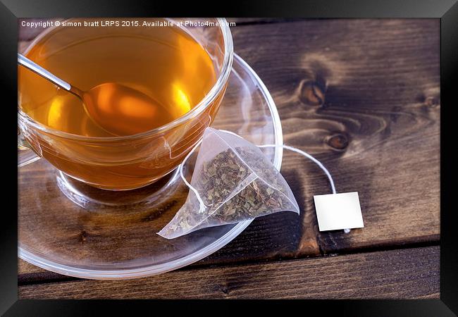 Green tea in glass teacup Framed Print by Simon Bratt LRPS