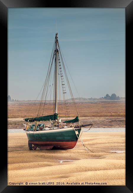 Sail boat stranded at low tide on sand Framed Print by Simon Bratt LRPS