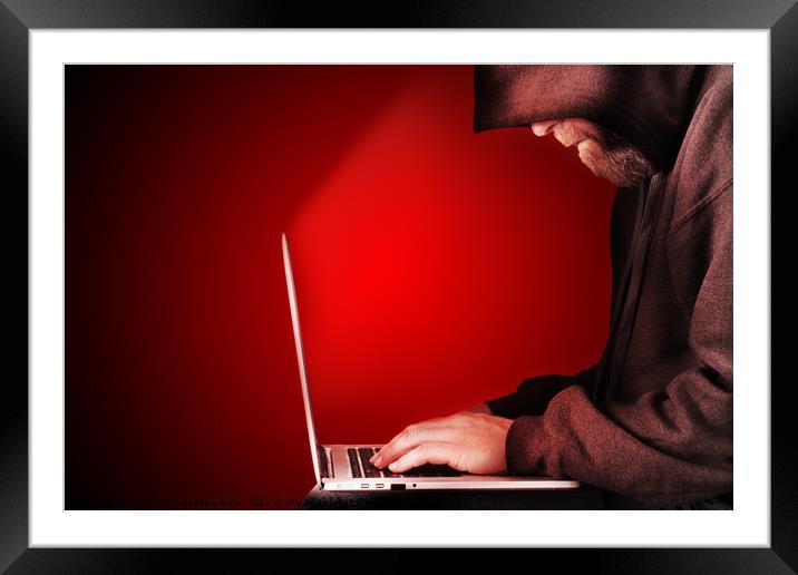 Hooded computer hacker red background Framed Mounted Print by Simon Bratt LRPS