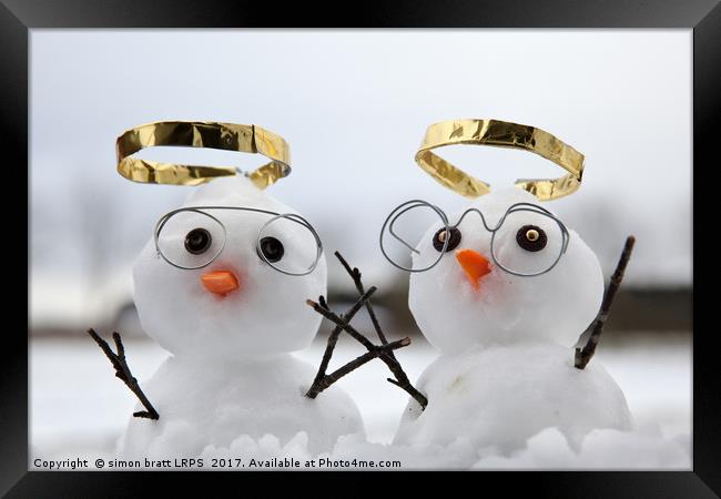Two cute snowman angles with golden halos Framed Print by Simon Bratt LRPS