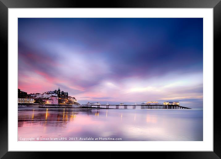 Famous Cromer pier in Norfolk England with pink su Framed Mounted Print by Simon Bratt LRPS