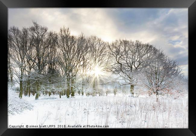 Snow covered rural trees with early morning sunris Framed Print by Simon Bratt LRPS