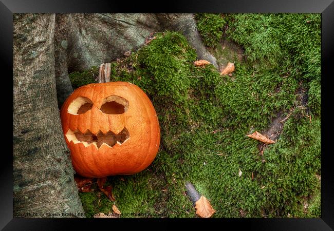 Scary halloween pumpkin in the woods Framed Print by Simon Bratt LRPS