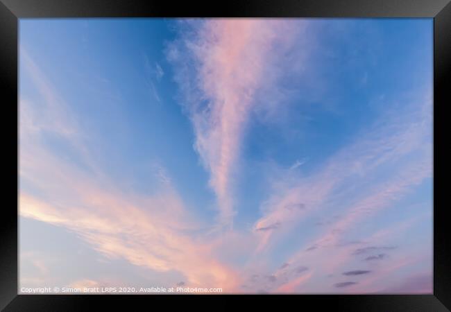Pink cloud lines and blue skies Framed Print by Simon Bratt LRPS