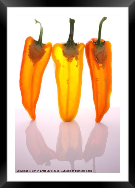 Peppers in half with light through them Framed Mounted Print by Simon Bratt LRPS