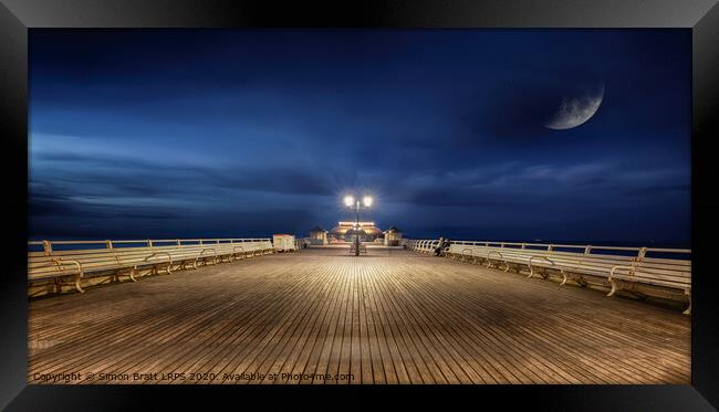 Cromer Pier Norfolk under a moon lit sky Framed Print by Simon Bratt LRPS