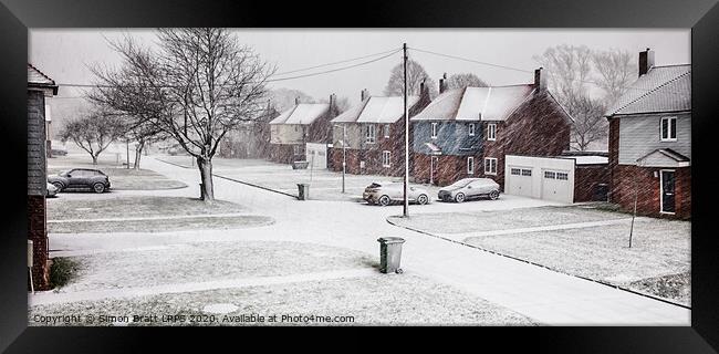 Snow blizzard street scene in rural Norfolk Framed Print by Simon Bratt LRPS