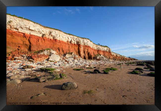 Red rock cliffs on Hunstanton beach Norfolk UK Framed Print by Simon Bratt LRPS