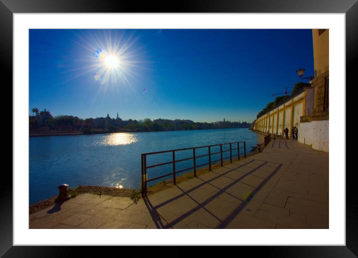 Sunny morning by the Guadalquivir River in Seville Framed Mounted Print by Jose Manuel Espigares Garc