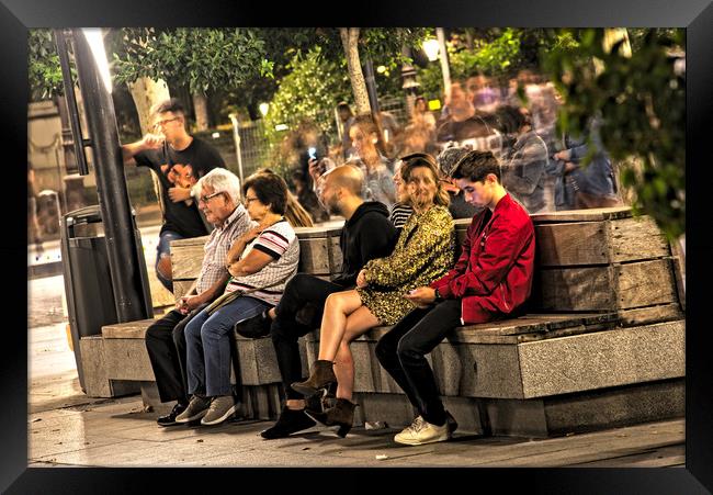 People sitting and relaxing in the evening Framed Print by Jose Manuel Espigares Garc