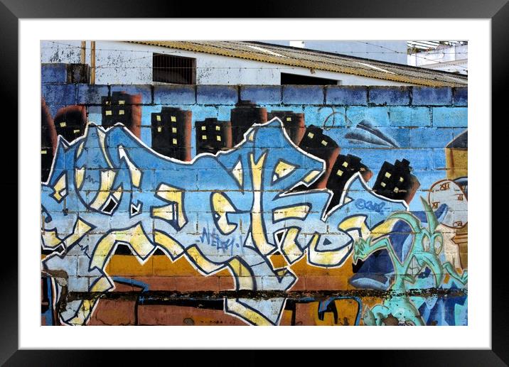 This is a graffiti painted on a wall in one of the Framed Mounted Print by Jose Manuel Espigares Garc