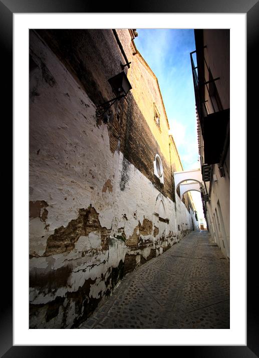 Narrow and lonely street with arch Framed Mounted Print by Jose Manuel Espigares Garc