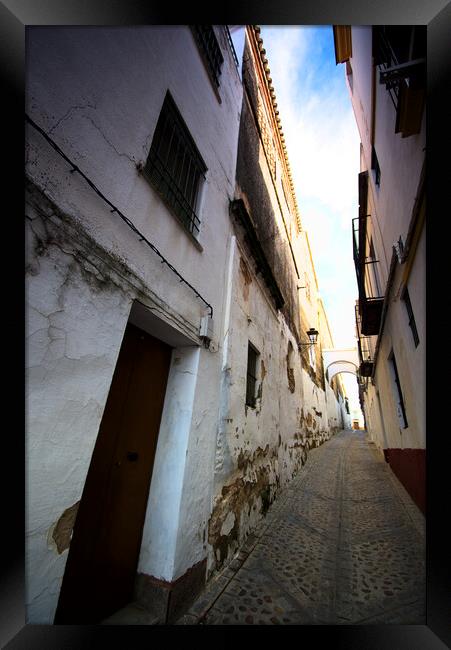 Narrow and lonely street with arch Framed Print by Jose Manuel Espigares Garc