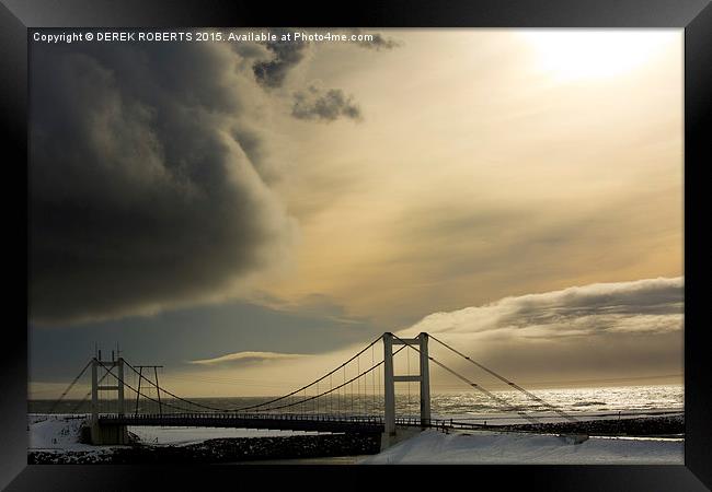 Passing storm at Jokulsarlon bridge Framed Print by DEREK ROBERTS