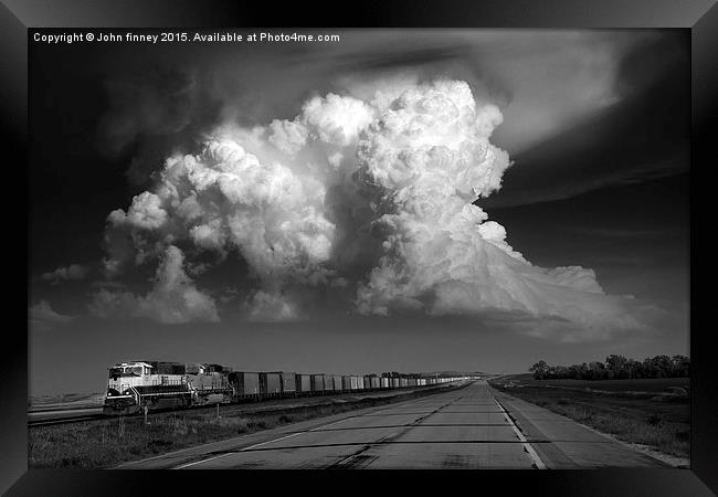 Convection over Freight train, Tornado alley, USA. Framed Print by John Finney