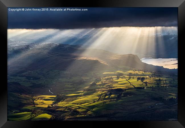 Light over Castlerigg stone circle Framed Print by John Finney